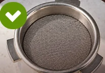 Puck screen placed on the tamped coffee